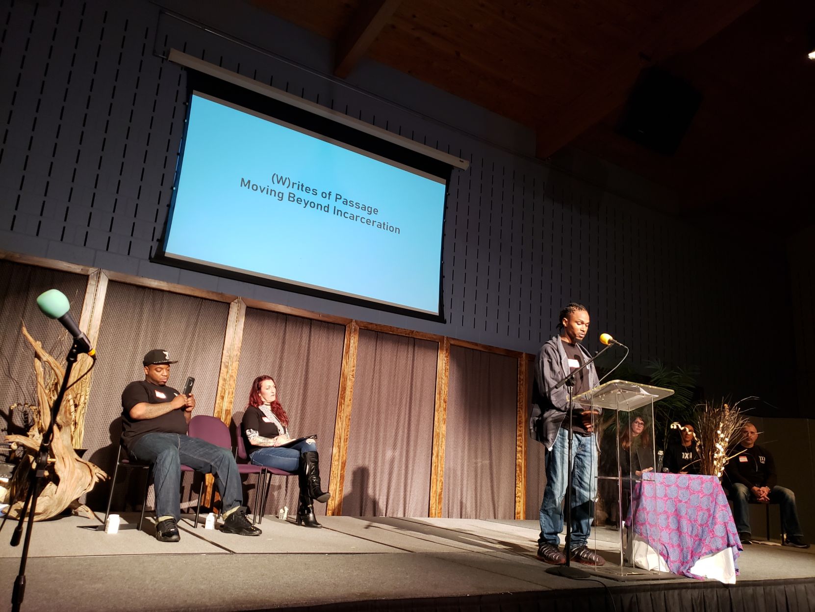 Phil Roberts at podium during (W)rites of Passage event at the Church Within
